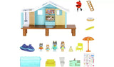 Bluey Beach Cabin playset parts and accessories laid out including family and pool – Ireland