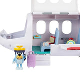 Close-up of Bluey's Adventure Plane with open passenger cabin, blue seats, tray table, Pilot Bluey wearing a yellow hat and purple suitcase.