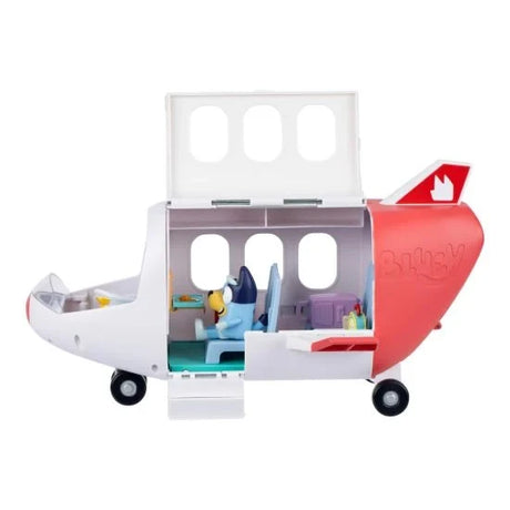 Bluey's white and red Adventure Plane with raised roof and open side panel, showing Bluey seated inside the passenger cabin with travel accessories.