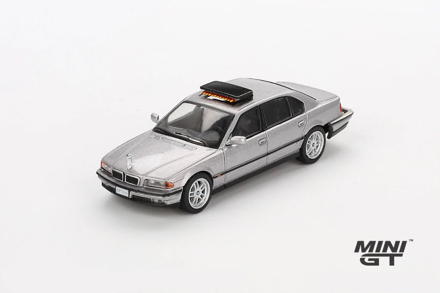 Mini GT James Bond BMW 750IL silver LHD model viewed from the front right showing the BMW kidney grille, headlights, bonnet and roof mounted unit