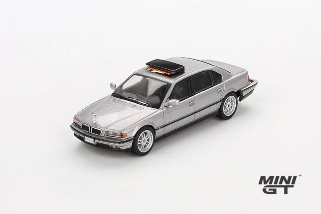 Mini GT James Bond BMW 750IL silver LHD model viewed from the front right showing the BMW kidney grille, headlights, bonnet and roof mounted unit