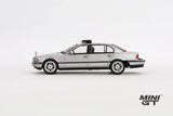 Silver BMW 750IL from Tomorrow Never Dies in full left side profile showing the four door body, black window trim, silver wheels and roof mounted unit