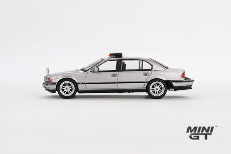 Silver BMW 750IL from Tomorrow Never Dies in full left side profile showing the four door body, black window trim, silver wheels and roof mounted unit