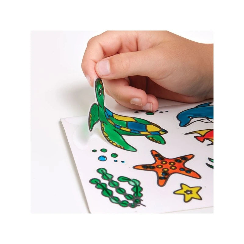 Brainstorm Colour Your Own Stickers Sea Creatures coloured turtle sticker being peeled from the sheet