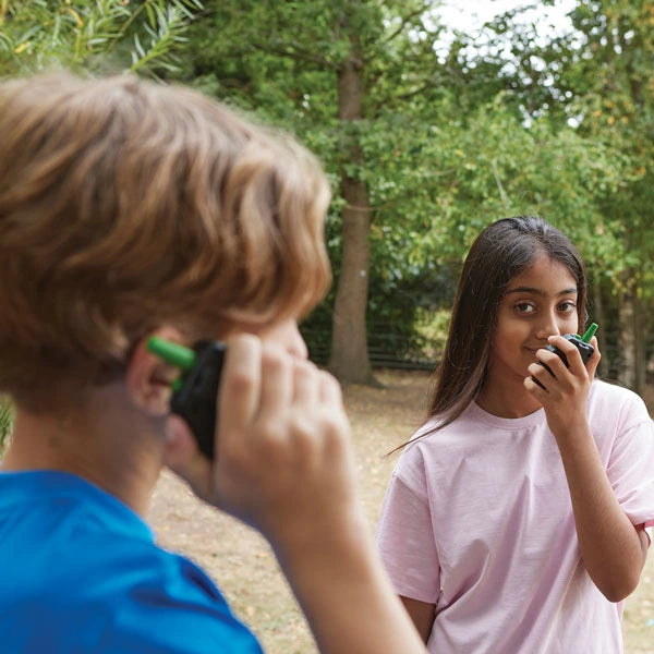 Brainstorm Outdoor Adventure Walkie Talkies being used by two children outdoors