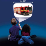 Two children using the Brainstorm Tractor and Truck Torch and Projector to display a fire engine image on a wall