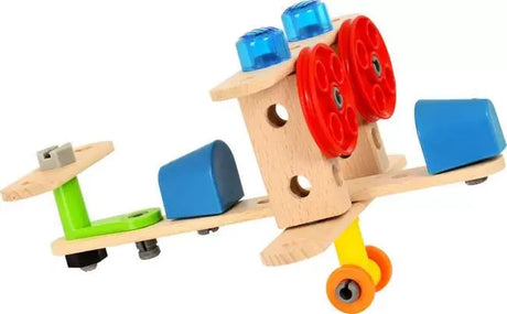BRIO Builder toy aircraft assembled from wooden pieces, red wheels, blue plastic components, grey bolts and a green connector.
