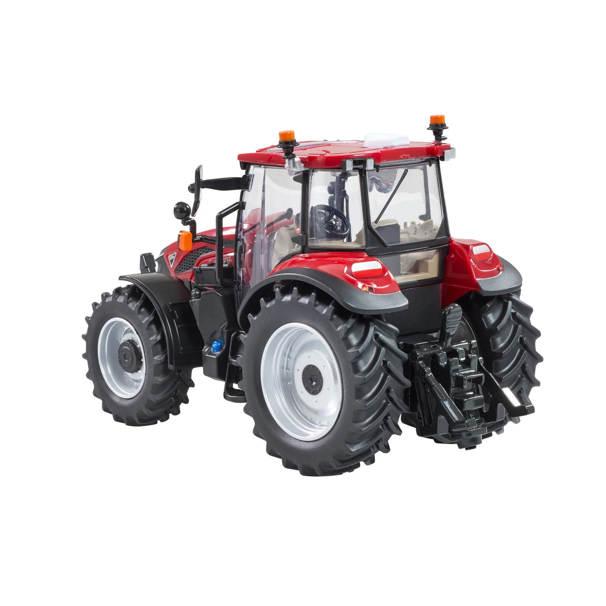 Britains Case Farmall 120 C farm toy tractor shown from the rear side with cab and rear hitch visible