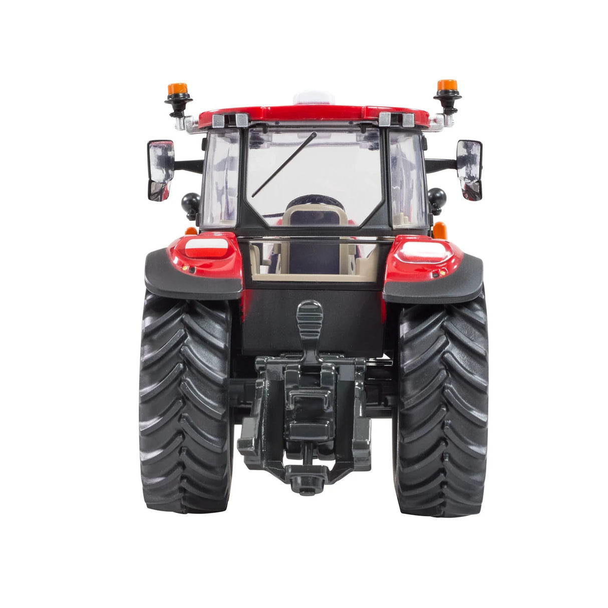 Britains Case Farmall 120 C farm toy tractor shown from the rear with large black tread tyres