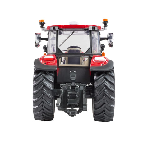 Britains Case Farmall 120 C farm toy tractor shown from the rear with large black tread tyres