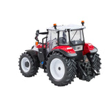 Britains Steyr 4120 Plus farm toy tractor shown from the rear side with grey cab, white wheels and tread tyres