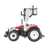 Britains Steyr 4120 Plus farm toy tractor shown side on with white bonnet, red side panel and open cab door