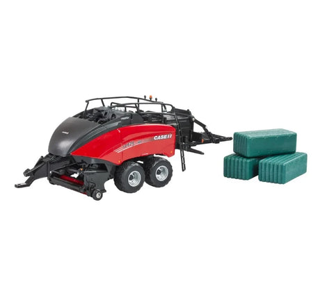 Britains Case IH LB434R XL large square baler model in red and black with rear hitch attached, twin axle wheels, and three green rectangular bales positioned beside the baler on a white background