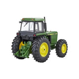 Britains John Deere 4450 tractor 1:32 scale model shown from the rear three quarter angle with rear hitch detail, cab windows, large rear tyres and roof lights visible on a white background