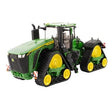 Britains John Deere 9RX 830 model 43399 tractor shown from front angle with green body, yellow wheels, four track units, cab glazing and exhaust stack