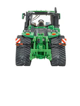 Britains John Deere 9RX 830 model 43399 tractor shown from rear view with rear hitch detail, twin rear track units, hazard markings and cab interior visible 