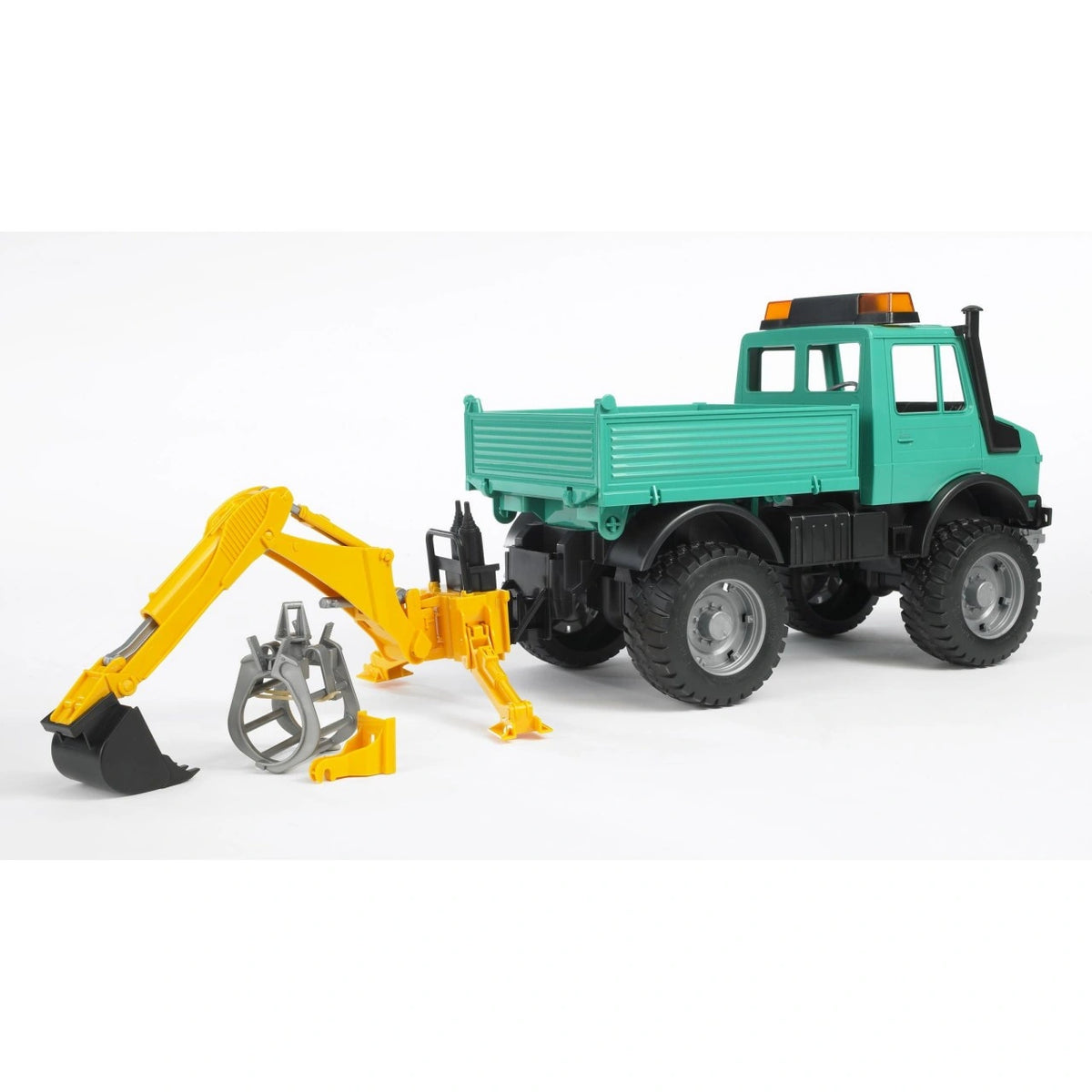 Bruder 02338 yellow hydraulic excavator attachment mounted behind a turquoise utility truck, with black digging bucket fitted, grey grab beside it and support legs extended.