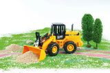 Bruder 1:16 articulated road loader FR 130 with the bucket pushing gravel in a play scene