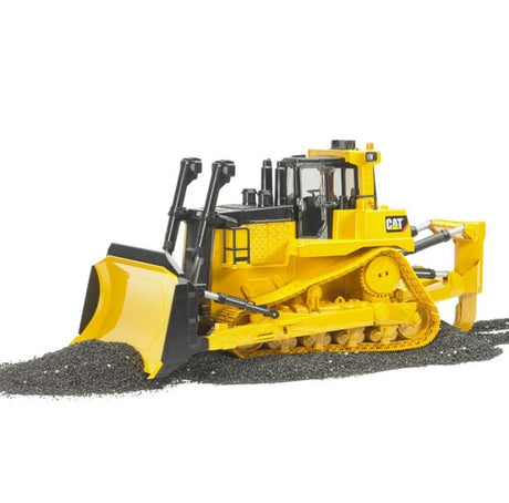 Bruder 1:16 Cat Large Track-Type Tractor pushing a pile of gravel with the front blade