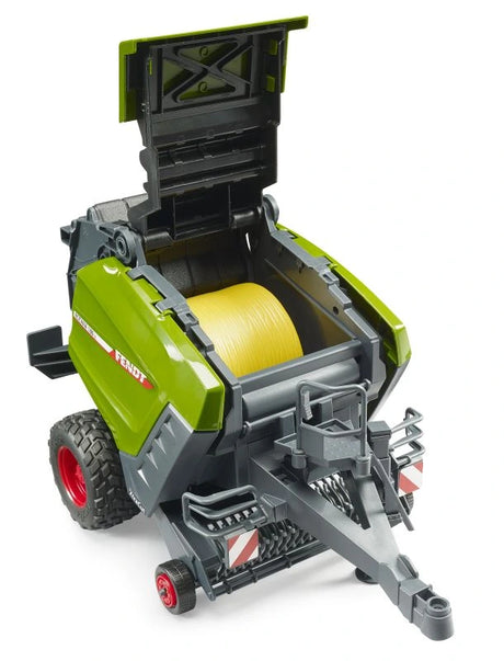Bruder Fendt Rotana 180V round baler with top section open and yellow round bale inside