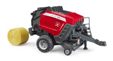 Bruder Massey Ferguson RB 4180V round baler with yellow round bale beside the rear