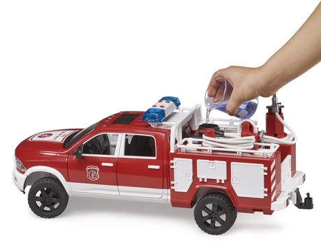 Bruder 1:16 RAM 2500 fire engine truck with water pouring from a cup into the rear tank