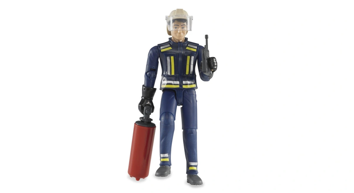 Bruder bworld Fireman with Accessories 60100 standing in navy blue firefighter uniform with yellow reflective stripes, beige helmet, black radio and red fire extinguisher