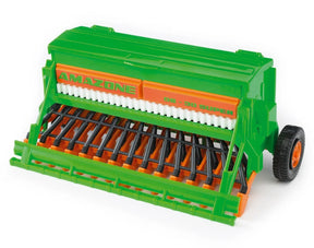A green and orange Bruder Amazone sower toy with black tines shown on a plain white background.