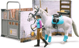 Figure leading a white horse beside the Bruder Bworld horse barn scene with stable tools