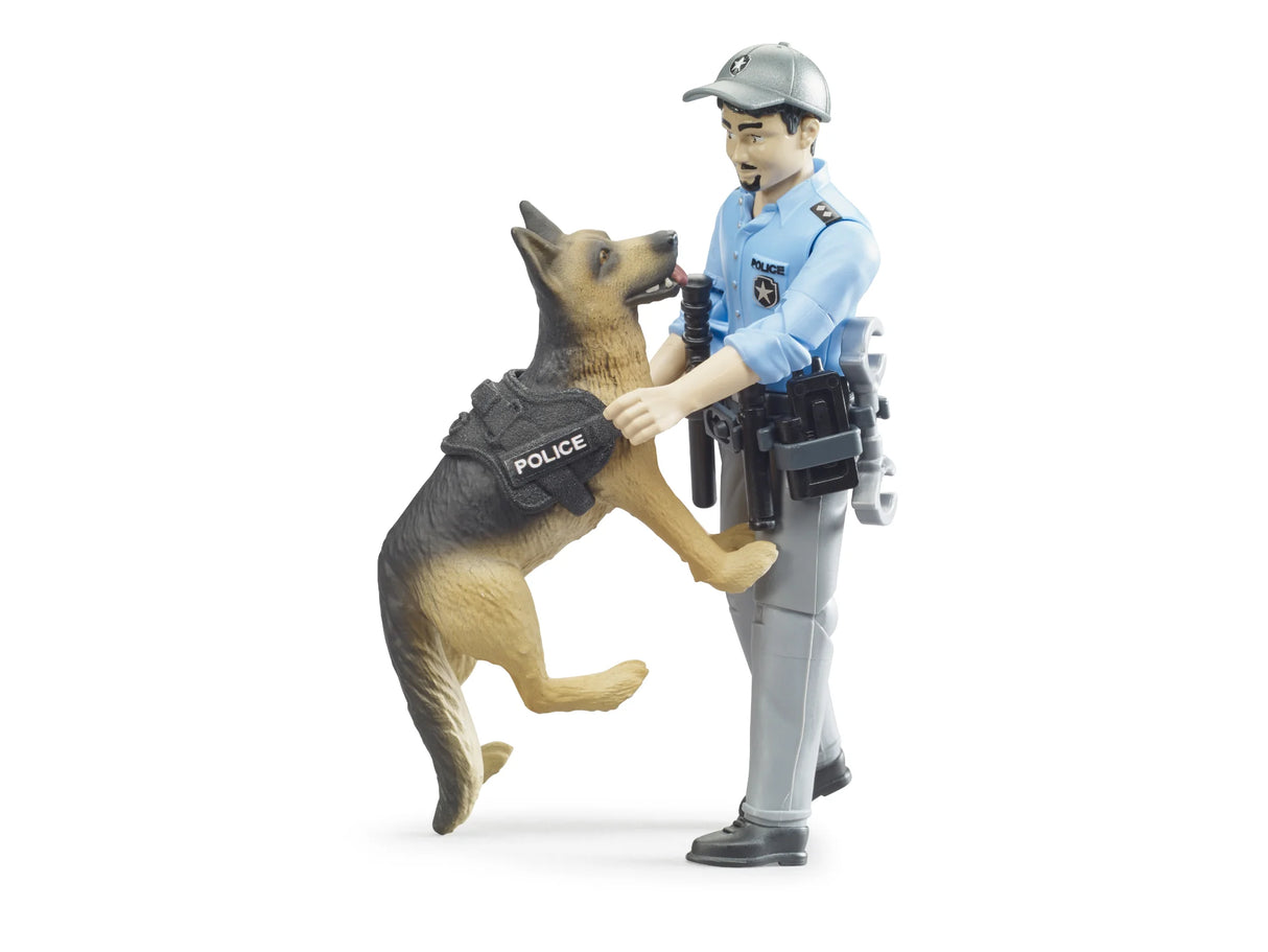 Bruder bworld police dog wearing a black harness marked POLICE with front paws raised against a police officer figure in a light blue shirt and grey trousers