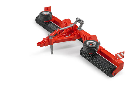 A red Bruder Cambridge Roller toy with black rollers and raised wheels shown on a plain white background.