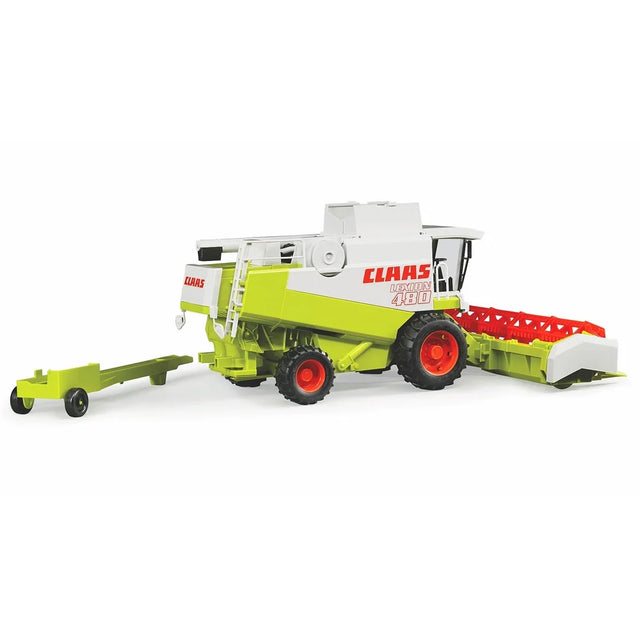 A side view of a Claas Lexion 480 toy combine harvester with its detachable header and tow bar.