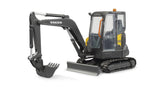 Angled view of Bruder Compack Excavator ECR40 showing rubber tracks, lifting blade, and movable bucket arm