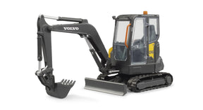 Angled view of Bruder Compack Excavator ECR40 showing rubber tracks, lifting blade, and movable bucket arm