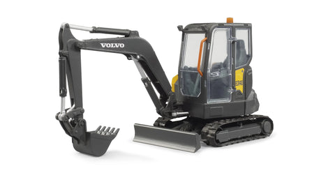 Angled view of Bruder Compack Excavator ECR40 showing rubber tracks, lifting blade, and movable bucket arm