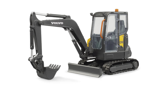 Angled view of Bruder Compack Excavator ECR40 showing rubber tracks, lifting blade, and movable bucket arm
