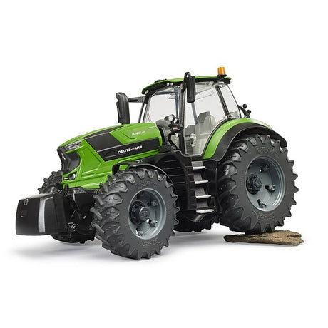 Bruder Deutz-Fahr 8280 TTV Tractor driving over field terrain with tread tyres and bright green body in Ireland