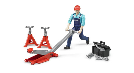 Bruder garage tools set with a mechanic figure, black tool box, loose tools and a red floor jack arranged on a white background