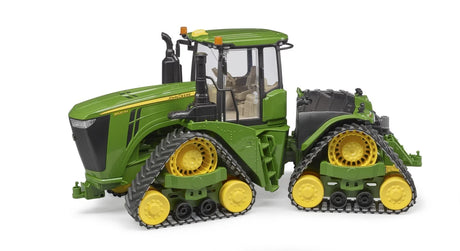 John Deere 9620RX tracked tractor toy in green and yellow with enclosed cab and four crawler track units