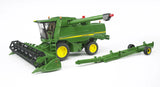 John Deere T670i combine harvester toy with front cutting header attached and separate green header trailer