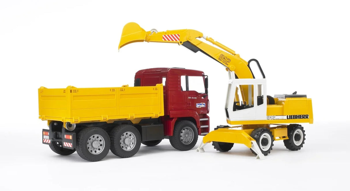 Bruder MAN TGA construction truck in red with yellow tipper body beside a Liebherr excavator in yellow with raised arm