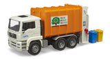 Bruder Man TGA rear loading garbage truck with white cab, orange refuse body and two bins beside the rear on a white background.