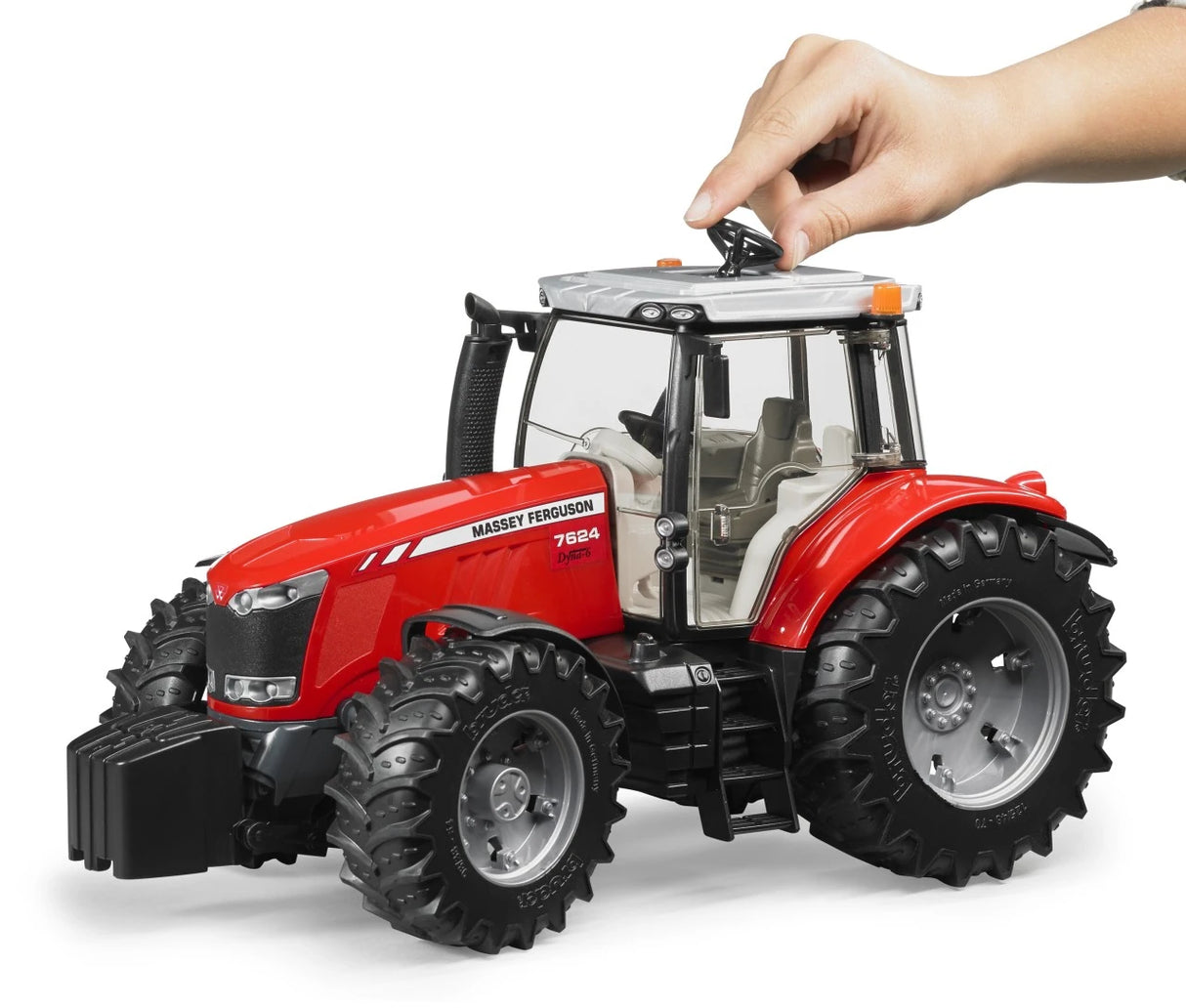 Red Massey Ferguson 7624 farm toy tractor with hand using roof steering control