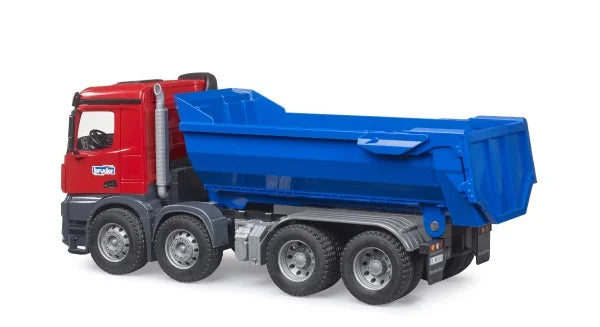 Bruder Mercedes Benz Arocs Half Pipe Dump Truck with red cab and blue tipping bed on white background.