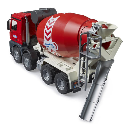 Rear view of Bruder Mercedes Benz Arocs cement mixer truck with extended grey discharge chute, red mixer drum, ladder, and rear wheels