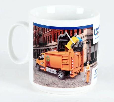 A ceramic Bruder mug showing artwork of an orange refuse truck beside coloured blocks.