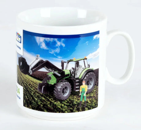 A ceramic Bruder mug showing artwork of a green tractor and a row of coloured blocks.