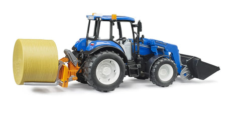 Blue farm toy tractor carrying a round bale on rear forks
