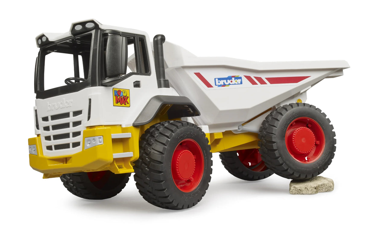 Bruder ROADMAX dumper truck, yellow chassis, red wheel hubs, white tipping trough, rear wheel on grey stone block