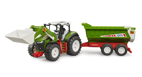 Bruder 1:16 Roadmax tractor farm toy side view with the front loader raised and tipping trailer attached